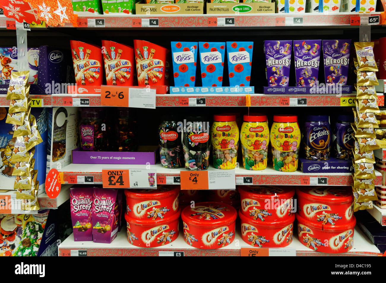 Boxes of chocolates on Sainsbury`s supermarket shelves at Christmas Stock Photo